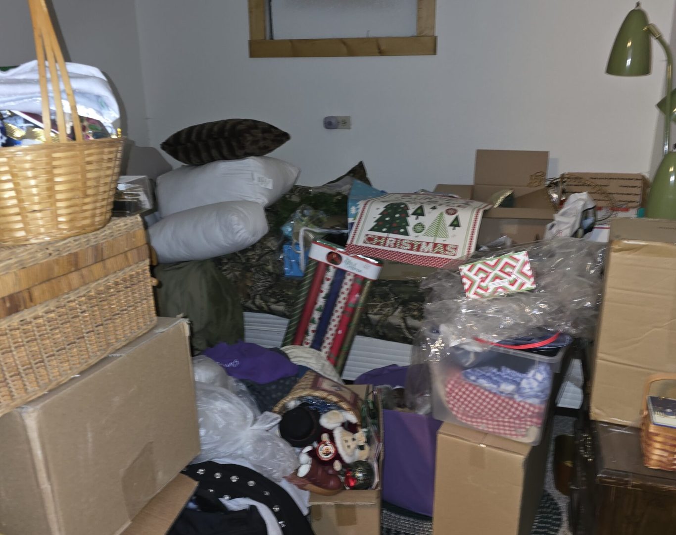 Cluttered room with household piles before estate cleanout in Park County, WY—Good Junk Removal before-and-after transformation.