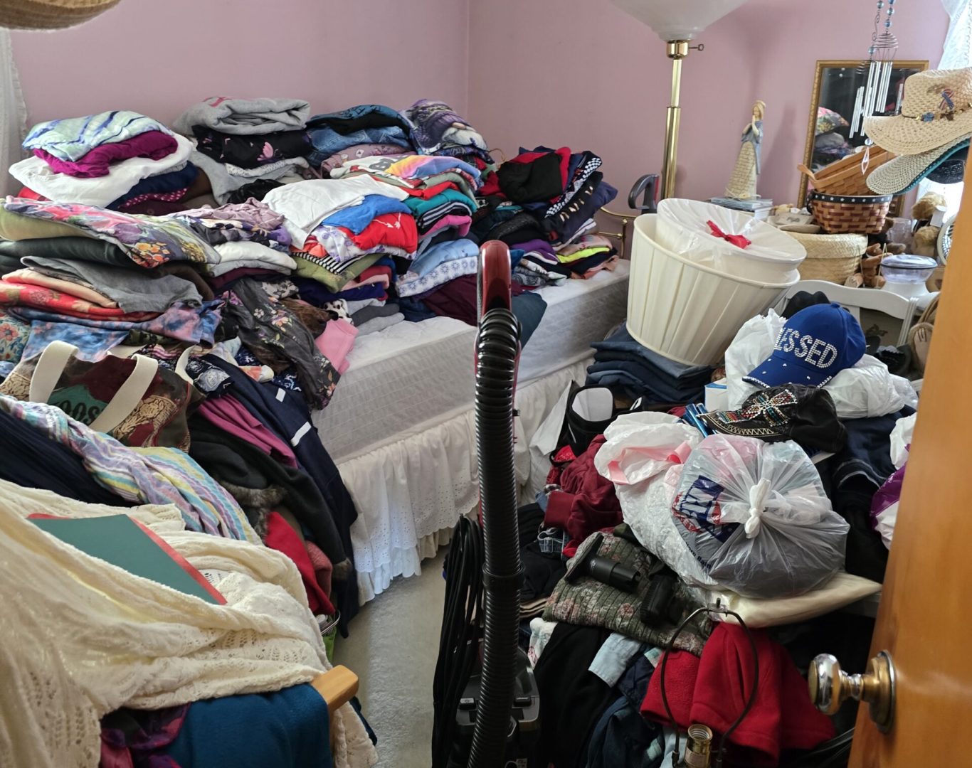 Cluttered room with piles of belongings before estate cleanout in Park County, WY—Good Junk Removal transformation.